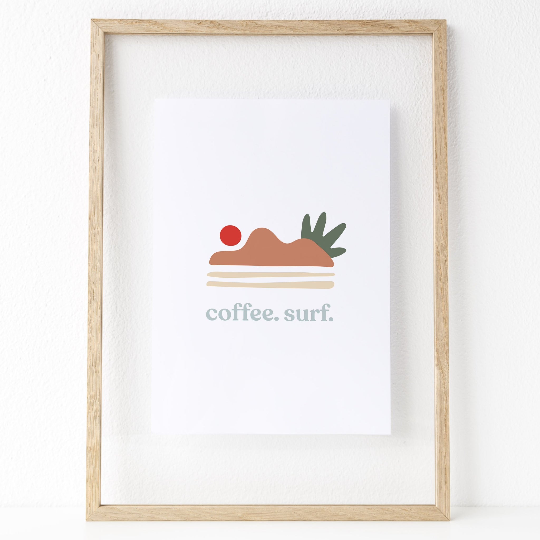 Coffee. Surf. Print. The print features some abstract shapes that resemble a sun setting over some hills. Hues of red, rust orange, dark forest green, and a neutral cream are featured in this print. 