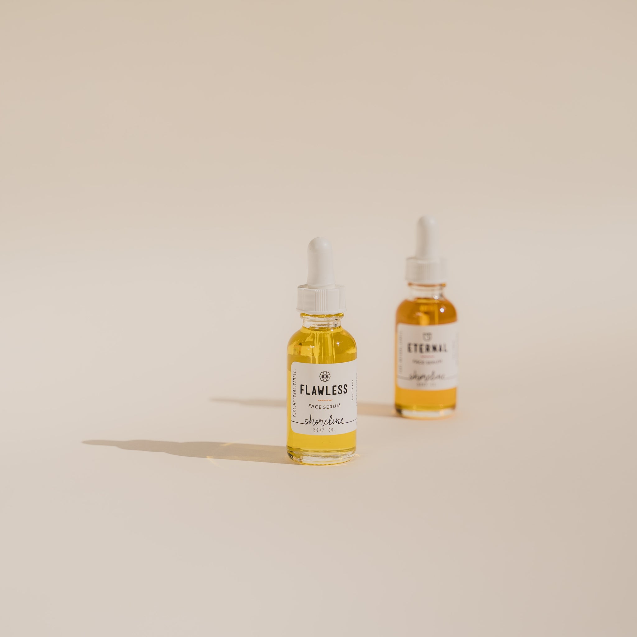 Eternal Serum and Flawless Serum pictured together. 